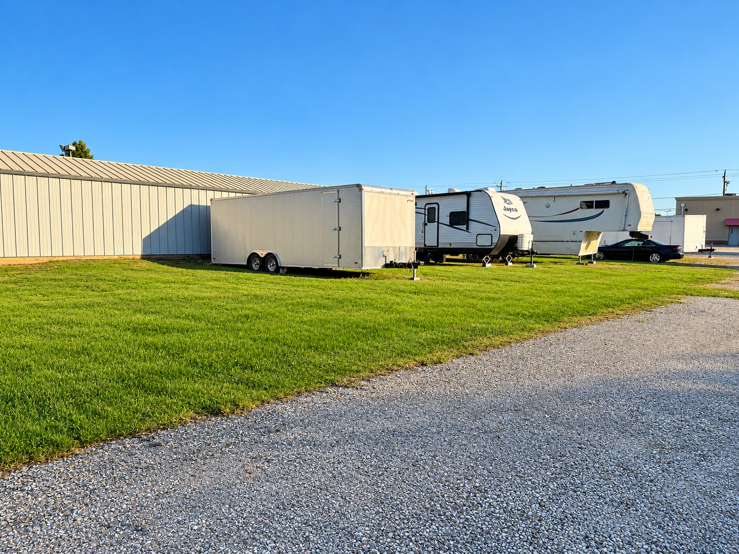 Large RV and camper parking on grass at Washington Self Storage